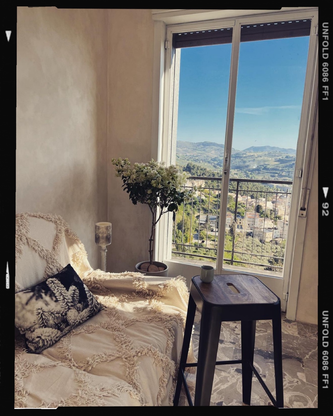 Reading corner beside the balcony with countryside view