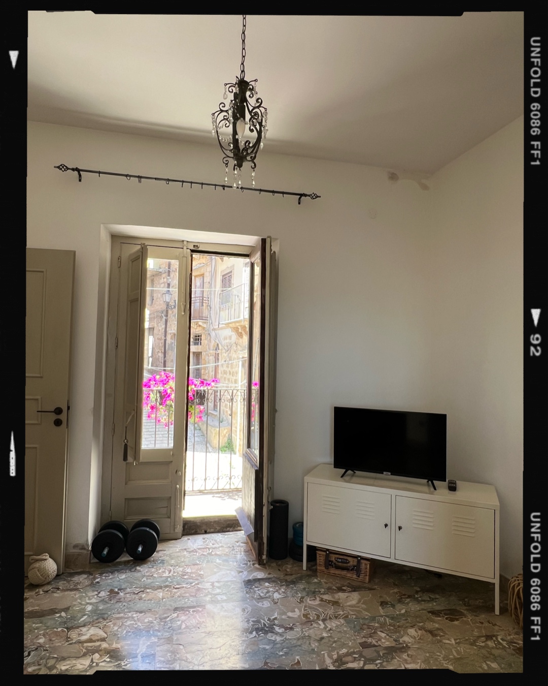 Living room with balcony doors onto the old town street