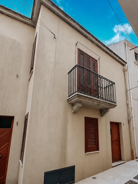 Exterior of Casa Zia with its wooden balcony