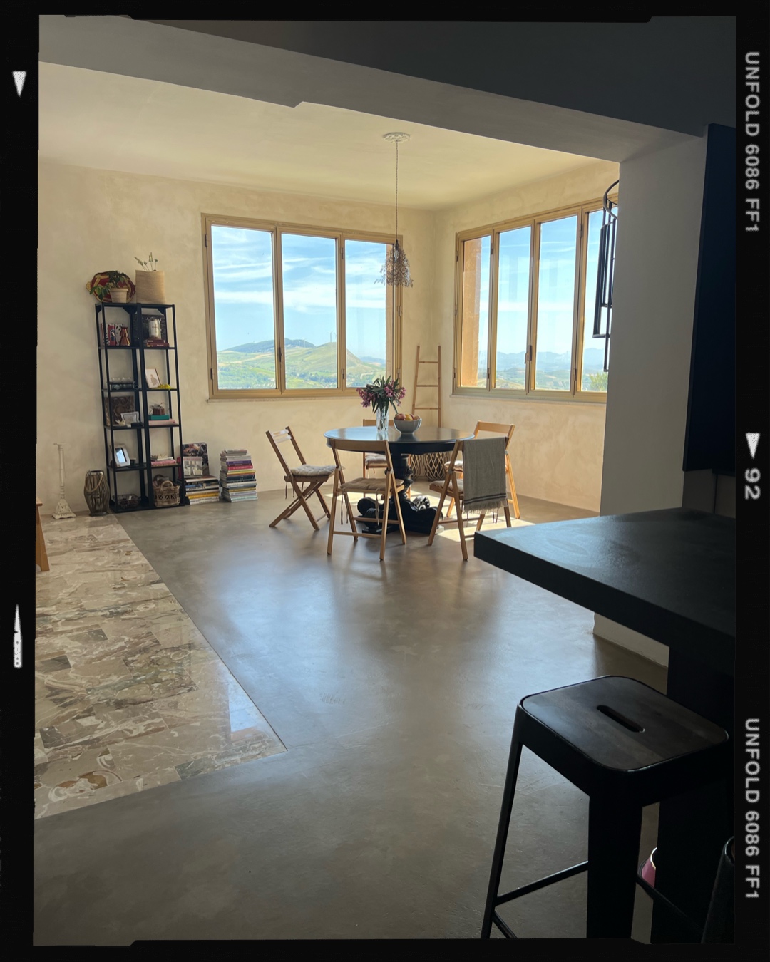 Dining area with corner windows over the Salemi hills